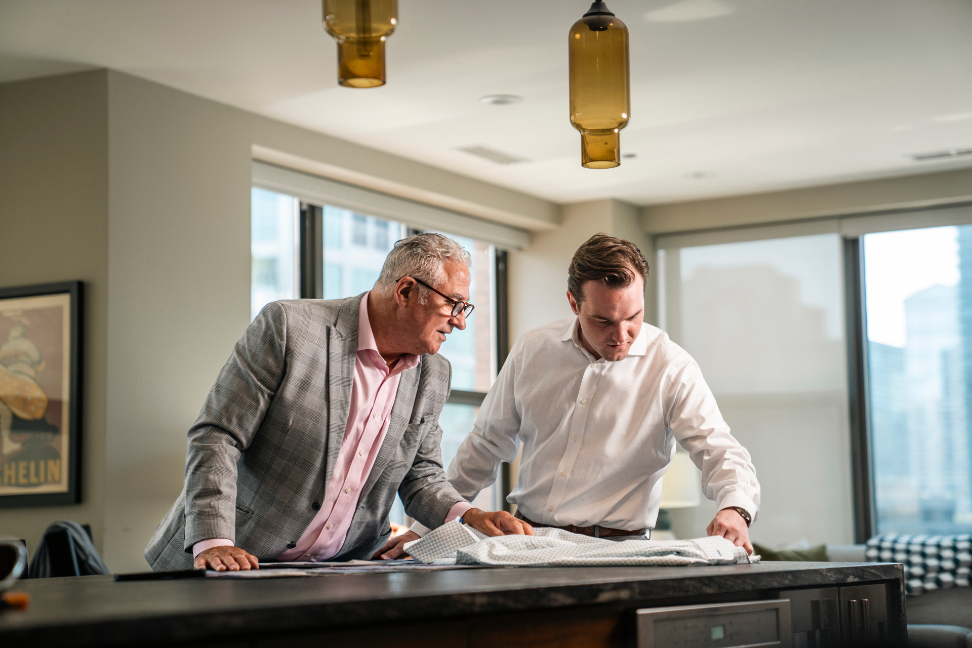 Dan consulting with a client over fabric selections in a private fitting